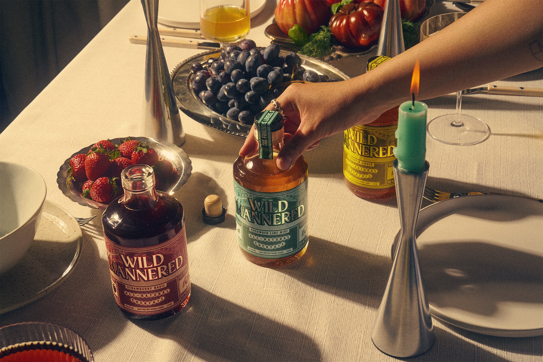 Communal social setting with Cucumber Lime Mint, Pineapple Ginger, Strawberry Basil Wild Mannered all-natural soju cocktails