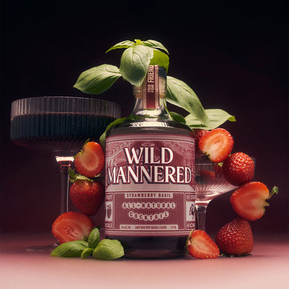 375 ml bottle of Strawberry Basil Wild Mannered all-natural soju cocktail with cocktail glass, strawberries and basil 